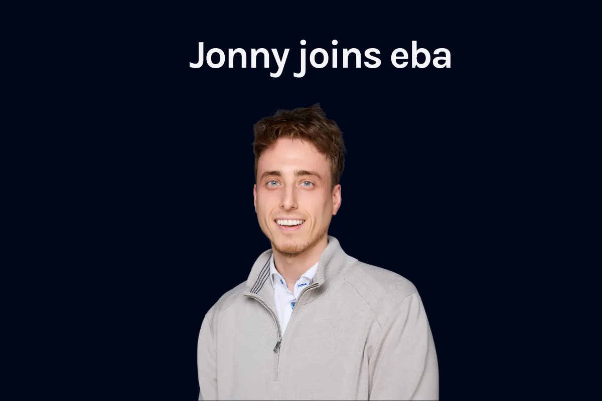 Jonny Elliott photographed against a navy background beneath the words Jonny joins eba.